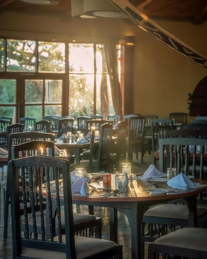 The restaurant during the day, with tables set in front of large windows