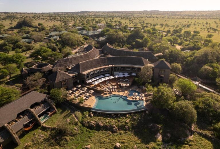 Four Seasons Safari Lodge Serengeti from the air, with its infinity pool in the middle of the wooded savanna