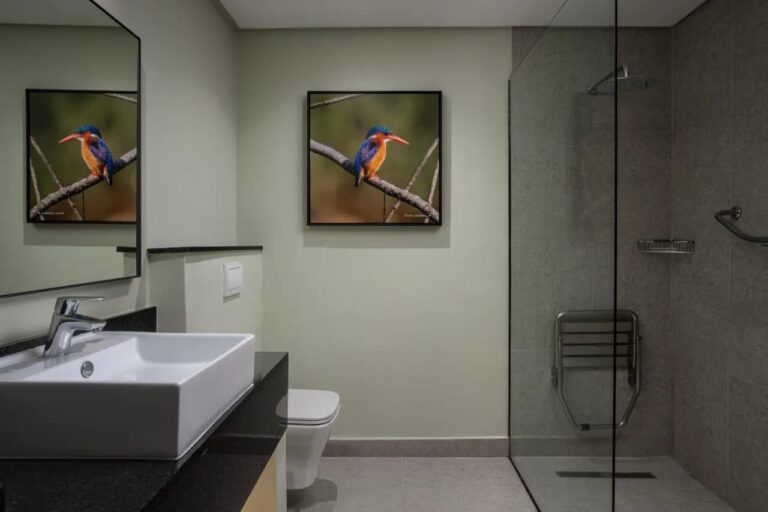The bathroom of a Deluxe room, with a walk-in shower