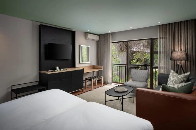 The seating area of a Deluxe room, facing the picture window