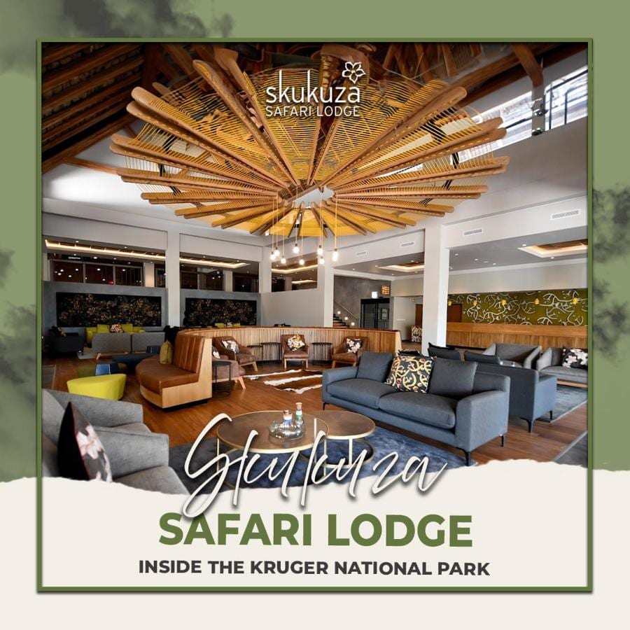 The lobby lounge of Skukuza Safari Lodge under its star-patterned wooden slat ceiling, with the lodge's name written across the image